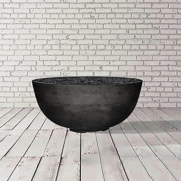 The Prism Hardscapes Moderno 1 Gas Fire Bowl in ebony, crafted with dark concrete, displays a bold and modern aesthetic. Perfect for outdoor fire bowls or fire pit tables, this large fire pit design creates a contemporary ambiance for your outdoor living space, making it an excellent addition to your backyard fire pit collection.