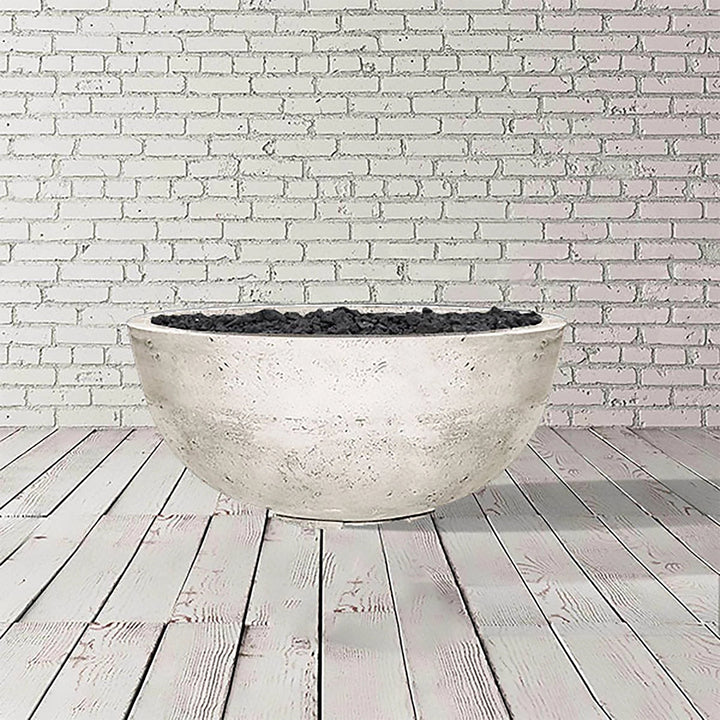 This image features the Prism Hardscapes Moderno 1 Gas Fire Bowl in natural gray, highlighting the sleek concrete texture. An ideal centerpiece for outdoor fire pit tables, it offers a balanced blend of industrial charm and modern fire pit design. Perfect for those seeking a commercial fire pit or a stylish addition to their outdoor patio fire pits.