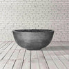 A light gray version of the Prism Hardscapes Moderno 1 Gas Fire Bowl in pewter. This outdoor fire pit boasts a durable concrete build with a smooth finish, suitable for both large outdoor fire bowls and more intimate fire pit tables. Its simple yet sophisticated design makes it a perfect fit for modern outdoor fire pits.