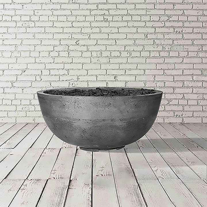 A light gray version of the Prism Hardscapes Moderno 1 Gas Fire Bowl in pewter. This outdoor fire pit boasts a durable concrete build with a smooth finish, suitable for both large outdoor fire bowls and more intimate fire pit tables. Its simple yet sophisticated design makes it a perfect fit for modern outdoor fire pits.