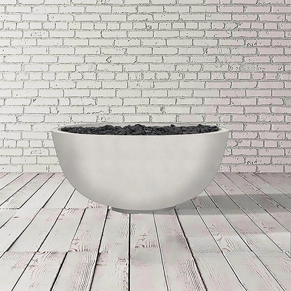 The Prism Hardscapes Moderno 1 Gas Fire Bowl in ultra white, with its clean, minimalist design, is shown in this image. This smooth concrete outdoor fire pit is perfect for those looking for a luxury fire pit experience. Its versatile design complements a range of modern outdoor spaces, ideal for backyard fire pits and commercial settings alike.