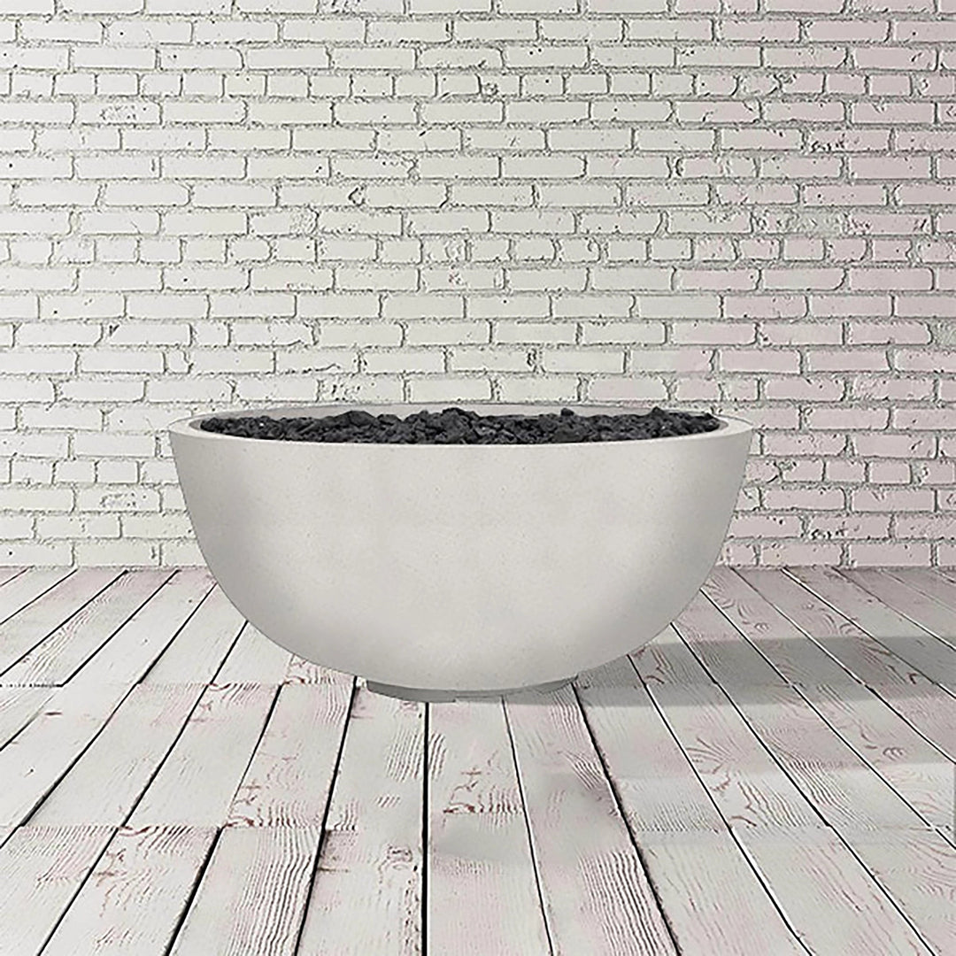 The Prism Hardscapes Moderno 1 Gas Fire Bowl in ultra white, with its clean, minimalist design, is shown in this image. This smooth concrete outdoor fire pit is perfect for those looking for a luxury fire pit experience. Its versatile design complements a range of modern outdoor spaces, ideal for backyard fire pits and commercial settings alike.