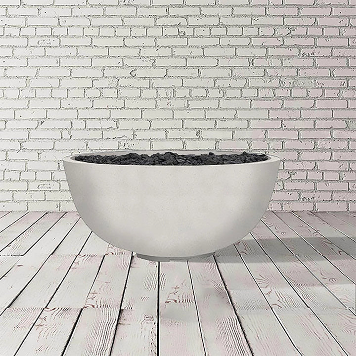 The Prism Hardscapes Moderno 1 Gas Fire Bowl in ultra white, with its clean, minimalist design, is shown in this image. This smooth concrete outdoor fire pit is perfect for those looking for a luxury fire pit experience. Its versatile design complements a range of modern outdoor spaces, ideal for backyard fire pits and commercial settings alike.
