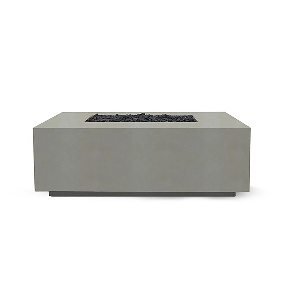 Showcased here is the Prism Hardscapes Portos 58" Propane Fire Table in natural finish, blending seamlessly into a lush outdoor scene. The natural beige hue adds warmth and elegance to any patio or backyard setup, making it ideal for a fire pit outdoor gas installation. This durable fire table combines practicality with beauty, featuring a large burner area filled with black lava rock. Perfect for backyard fire pit lovers who appreciate natural tones.