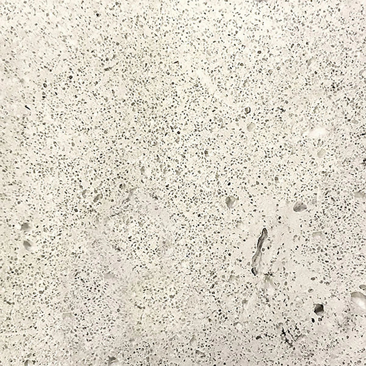  Swatch of the Prism Hardscapes Portos 58 Propane Fire Table in natural finish. This light, neutral tone provides a subtle and versatile look, perfect for blending into a variety of outdoor styles. Its smooth surface texture adds an elegant touch to outdoor settings, ideal for patios looking for a clean and sophisticated fire table.