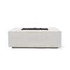 The Prism Hardscapes Portos 58" Propane Fire Table in ultra-white is showcased in a modern outdoor setting, creating a striking contrast with nature. This bright and contemporary fire table offers a clean, minimalist design with a smooth concrete surface. It provides a powerful propane flame that makes it ideal for both commercial fire pits and backyard fire pit areas. This fire table is perfect for those looking for a sleek and modern fire pit for their patio or outdoor space.
