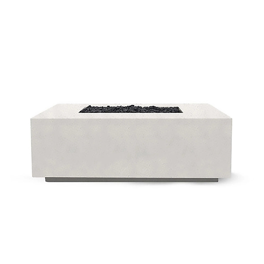 The Prism Hardscapes Portos 58" Propane Fire Table in ultra-white is showcased in a modern outdoor setting, creating a striking contrast with nature. This bright and contemporary fire table offers a clean, minimalist design with a smooth concrete surface. It provides a powerful propane flame that makes it ideal for both commercial fire pits and backyard fire pit areas. This fire table is perfect for those looking for a sleek and modern fire pit for their patio or outdoor space.