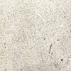 Light-colored concrete texture of the Prism Hardscapes Portos 68 Propane Fire Table in natural finish. This elegant and neutral fire table option is designed for creating a warm and inviting atmosphere in outdoor spaces, perfect for a natural gas fire pit setup or luxury outdoor patio.
