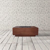 The Prism Hardscapes Tavola 3 Gas Fire Pit in cafe finish, showcasing a modern, rectangular design. This concrete fire pit provides a warm focal point for outdoor settings, ideal for contemporary patio designs. Constructed from durable materials, it’s designed to endure various weather conditions, making it an ideal outdoor gas fire pit for any backyard or garden. Perfect for entertaining around a long-lasting fire. 