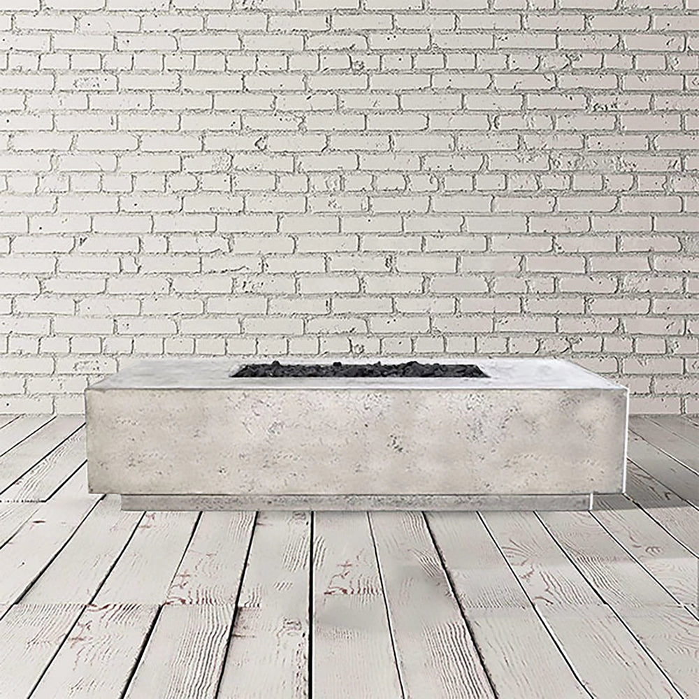 Prism Hardscapes Tavola 4 Gas Fire Pit in natural gray, highlighting its smooth concrete surface and rectangular form. This fire pit blends durability with a minimalist design, creating an inviting atmosphere for any outdoor living area. Perfect for outdoor patio fire pits and natural gas fire pit installations