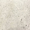 A close-up image of the Prism Hardscapes Tavola 42 Gas Fire Pit swatch in natural gray. The speckled texture of the concrete features a light, neutral tone, making it a versatile choice for any outdoor space. This finish pairs well with various backyard fire pits, offering both durability and style in a natural aesthetic.