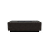 Prism Hardscapes Tavola 7 Gas Fire Pit in ebony finish, showcasing an angled view of its sleek, minimalist design. This premium outdoor fire pit is crafted from durable concrete, offering a bold statement in any backyard. Ebony finish provides a modern aesthetic, complementing various outdoor styles. Fueled by gas for hassle-free outdoor heating.