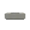 Prism Hardscapes Tavola 7 Gas Fire Pit in natural finish, featuring a natural concrete look that blends seamlessly with outdoor environments. The low-profile design and rectangular shape make this fire pit a centerpiece for patios or backyards. Designed for gas-fueled flames, it offers warmth and ambiance with a sleek, contemporary aesthetic. 