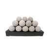 Natural-colored Rasmussen Alterna Vent-Free FireBalls in a 24-inch pyramid arrangement, suitable for modern outdoor fire pits. These vent-free fireballs provide efficient heating with a rustic appearance, enhancing the visual appeal of fire pit tables and outdoor fire bowls.