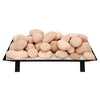 Large stack of beige Rasmussen Vented FireStones on a vented tray, showcasing a natural, smooth texture. A durable, decorative choice for outdoor gas fireplaces, adding elegance and functionality to fire pit setups.