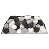 "Small rounded arrangement of black, white, and light gray Rasmussen Vented FireStones on a vented base. This color blend provides a subtle and sophisticated look for gas fireplaces, ideal for creating a stylish outdoor fire pit setup.