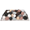 Calico-colored Rasmussen vented fire stones arranged flat on a metal tray, combining shades of black, white, brown, and gray. This multi-colored stone set is designed for vented fireplaces, adding a vibrant and varied aesthetic to fire features.