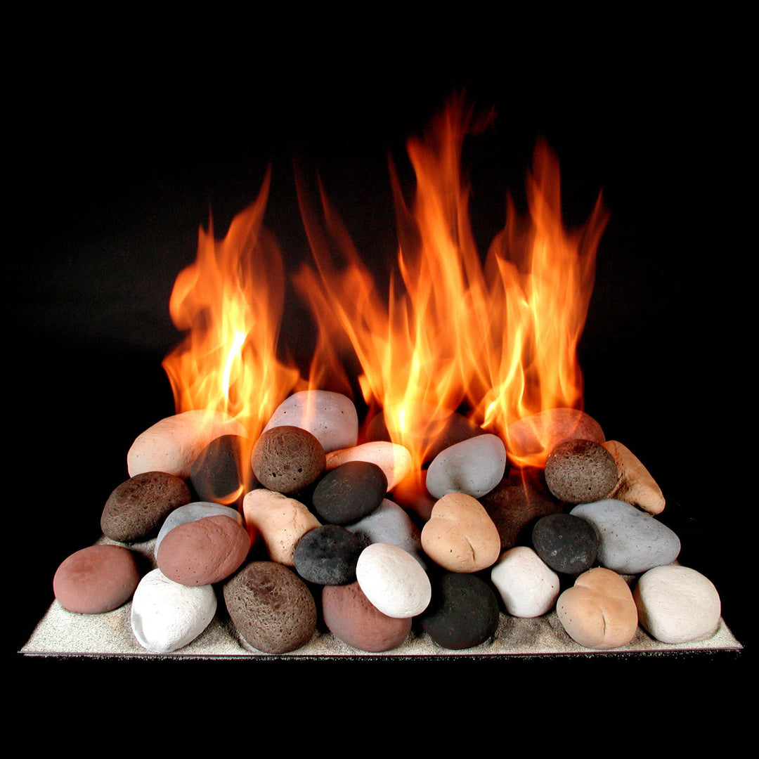 Rasmussen vented FireStones in a dynamic flame display, featuring a mix of colors including white, black, beige, and red stones. This setup showcases the fire stones in action, creating a vibrant, natural fire pit ambiance. Ideal for both outdoor and indoor fireplaces, these decorative fire stones add an aesthetic touch to gas fire pits, enhancing warmth and style. Vented fire stones, gas fireplace decor, outdoor fire pit stones, Rasmussen FireStones, realistic flame setup.