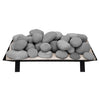 Rasmussen vented fire stones in light gray, stacked on a metal grate. Designed for vented fireplaces, these stones offer a subtle and elegant look, enhancing the ambiance of any fire feature with a gentle aesthetic.