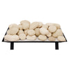 Stacked natural-colored Rasmussen vented fire stones on a metal platform, perfect for vented fireplaces. These stones offer a realistic and traditional look, adding a cozy and rustic element to any fireplace or outdoor fire pit.