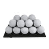 Rasmussen Vented Uniform FireBalls in light grey, arranged on a black base in a pyramid formation. These fireballs are made to withstand extreme heat and provide a sleek, modern look for any vented fireplace or fire pit. Perfect for creating a unique, decorative gas fire feature indoors or outdoors.