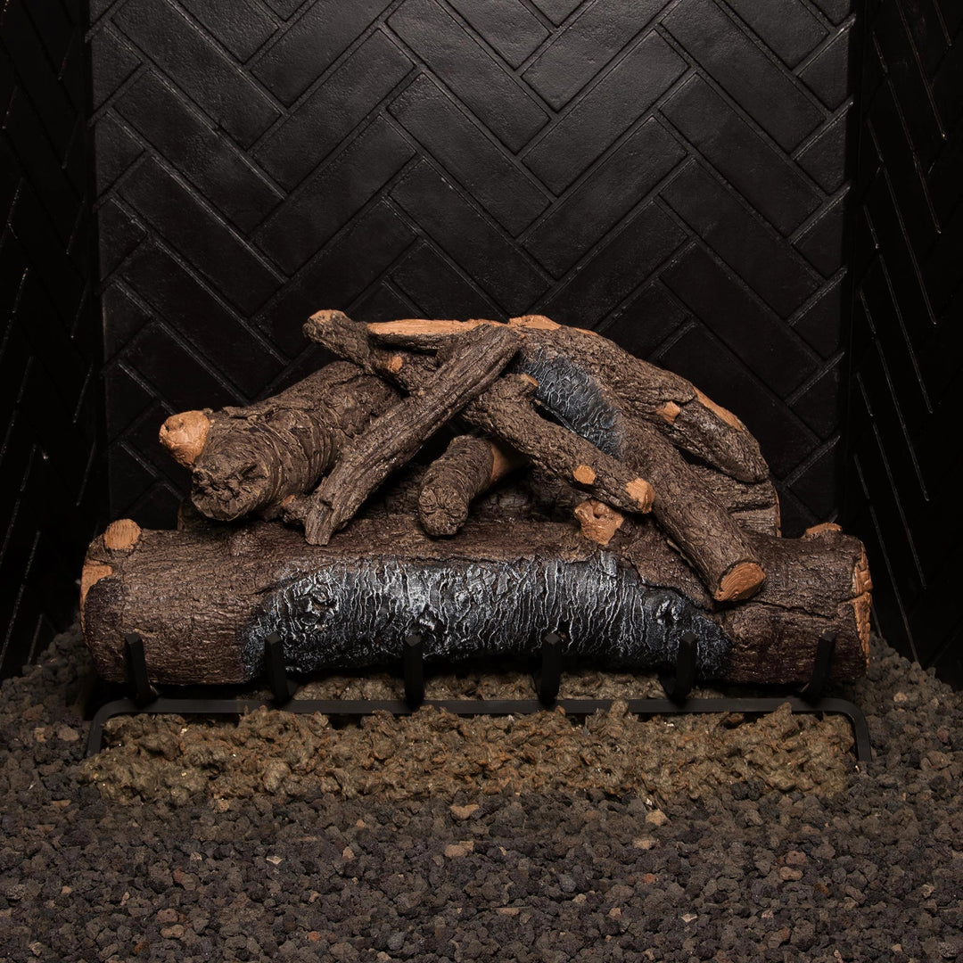 Real Fyre 30-inch Vented American Oak Gas Log Set arranged in a fireplace setting without fire. Logs exhibit realistic oak bark details, providing an authentic wood-burning look even when unlit. Ideal for creating a natural ambiance in gas fireplaces with a vented system.