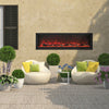 Remii Deep built-in electric fireplace installed outdoors, surrounded by a stylish patio setup with vibrant flame effects and sleek black design, enhancing outdoor relaxation.