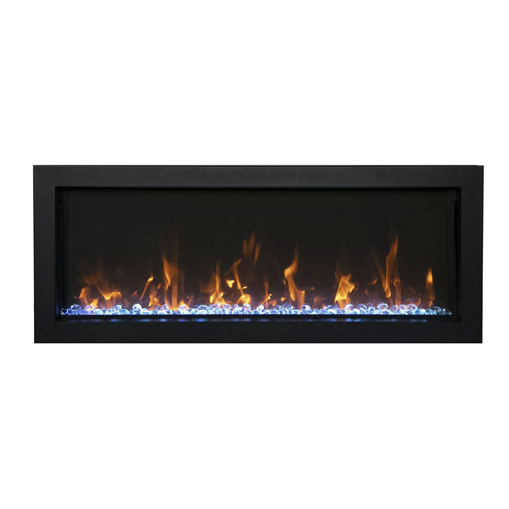  Remii Extra Slim indoor/outdoor electric fireplace featuring a unique combination of golden flames with icy blue crystal accents. The ultra-slim design and elegant black frame make it perfect for stylish living rooms, bedrooms, or patios with a focus on space-saving luxury.