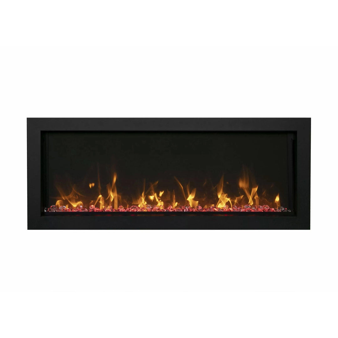 A sleek Remii Extra Slim indoor/outdoor built-in electric fireplace displaying realistic golden flames with vibrant orange ember bed. Ideal for modern indoor spaces or covered outdoor patios, this electric fireplace offers a minimalist black frame and slim profile for seamless wall integration.