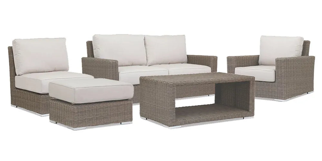 5-piece outdoor patio furniture set featuring a light gray wicker design with off-white cushions, including a sofa, two armchairs, an ottoman, and a coffee table