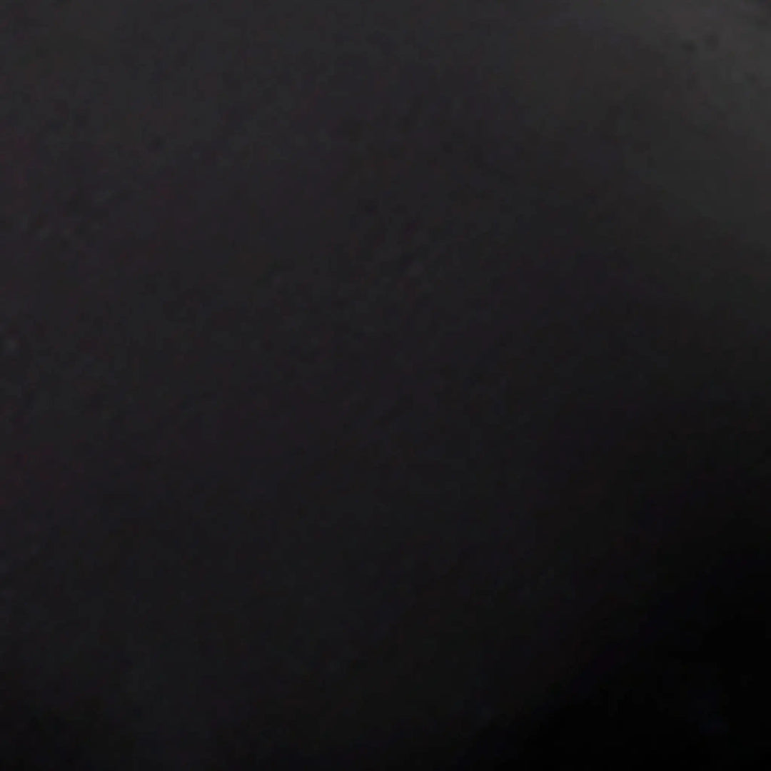 Swatch image of the Starfire Designs 4-inch Ceramic Fire Balls in black. This ceramic sample highlights the rich, dark black hue, adding a modern and bold look to any fire pit setup. The fire balls' sleek texture and heat-resistant properties make them perfect for contemporary outdoor spaces. With their durable design, these black ceramic fire balls create a striking contrast against flames, enhancing the overall ambiance of your outdoor fire pit.