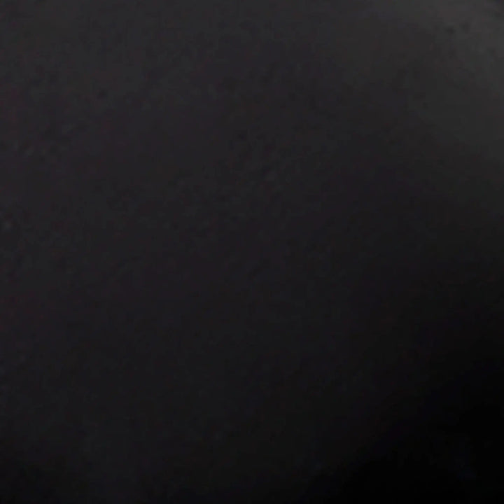 Swatch image of the Starfire Designs 4-inch Ceramic Fire Balls in black. This ceramic sample highlights the rich, dark black hue, adding a modern and bold look to any fire pit setup. The fire balls' sleek texture and heat-resistant properties make them perfect for contemporary outdoor spaces. With their durable design, these black ceramic fire balls create a striking contrast against flames, enhancing the overall ambiance of your outdoor fire pit.