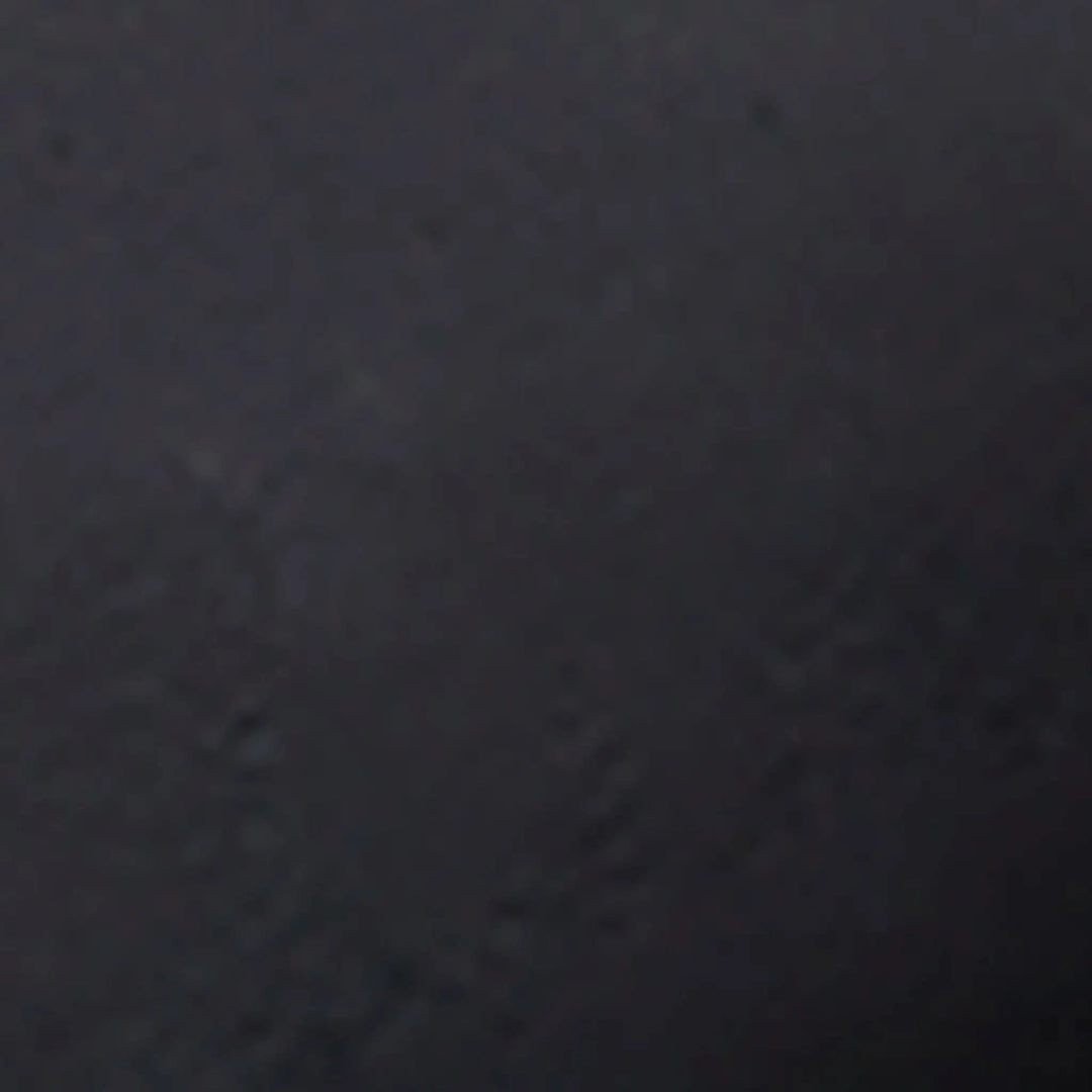 Swatch image of the Starfire Designs 4-inch Ceramic Fire Balls in dark gray. This sample reveals the deep gray tone of the ceramic fire balls, providing a versatile and understated look for outdoor fire features. The durable ceramic material is heat resistant and designed to endure high temperatures while maintaining its sleek dark gray finish. These fire balls offer a refined and sophisticated touch, ideal for modern fire pits and outdoor fireplaces.