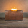 Side view of a 45-inch square copper outdoor fire pit from the Gravity Moreno collection by Starfire Designs, showcasing its sleek, hammered copper finish and modern design, ideal for luxury outdoor settings and patios