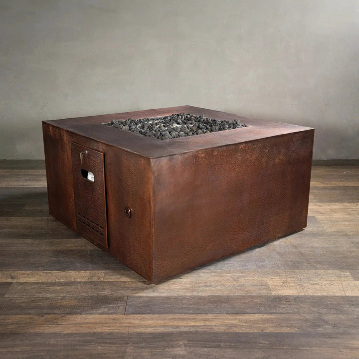 45-inch square copper fire pit by Starfire Designs featuring a hidden propane access door, with a hammered copper finish and robust design, ideal for luxurious outdoor patio settings