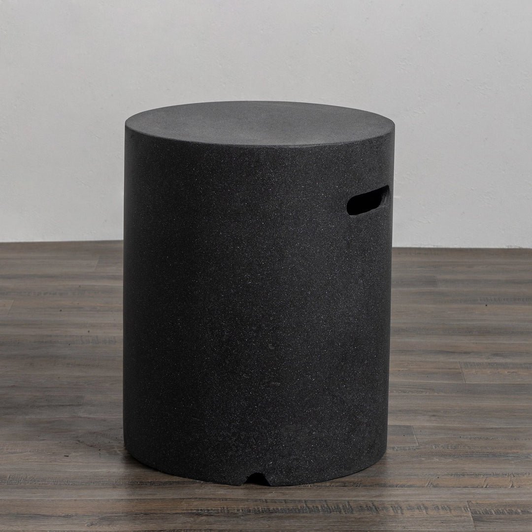 Angled view of the Starfire Designs Beton 16" Graphite Round Propane Tank Cover emphasizing its elegant construction, durability, and stylish graphite finish, ideal for contemporary backyard fire pits.