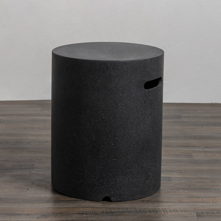 Angled view of the Starfire Designs Beton 16" Graphite Round Propane Tank Cover emphasizing its elegant construction, durability, and stylish graphite finish, ideal for contemporary backyard fire pits.