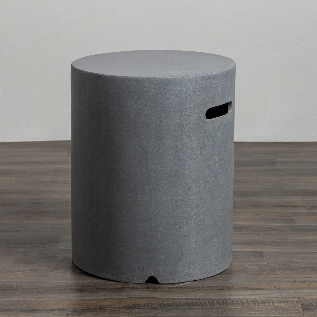 Close-up of the handle cutout on the Starfire Designs Beton 16" Natural Gray Round Propane Tank Cover, featuring precise craftsmanship and smooth edges. This durable and stylish cover is ideal for concealing propane tanks used with modern outdoor fire pits. Its natural gray tone complements various outdoor decors.