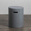 A side-angle view of the Starfire Designs Beton 16" Natural Gray Round Propane Tank Cover, highlighting its ergonomic cutout handle and minimalist cylindrical shape. Crafted from sturdy concrete in a natural gray finish, this tank cover is designed for outdoor fire pits and provides both aesthetic appeal and utility for patio settings.