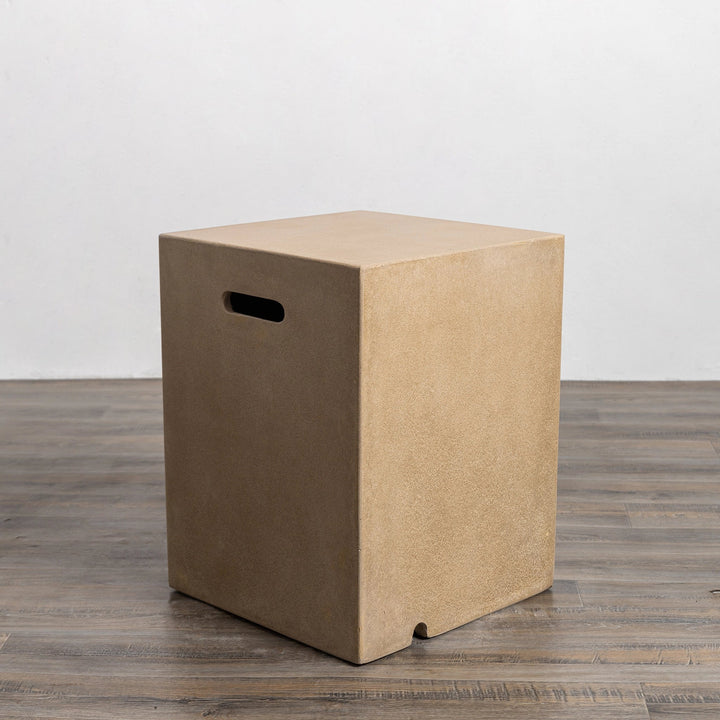 Top view of the Starfire Designs Beton 16" Sand Square Propane Tank Cover, emphasizing its flat surface and precision-cut side handle for effortless handling. The elegant sand finish adds a natural aesthetic to outdoor spaces while ensuring propane tank concealment.
