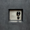 Detailed view of the Starfire Designs Beton 42-inch Graphite Gas Fire Pit's ignition control panel, featuring an easy-to-use dial for flame adjustment and an electronic igniter. The panel is recessed into the concrete surface for a clean, modern look.