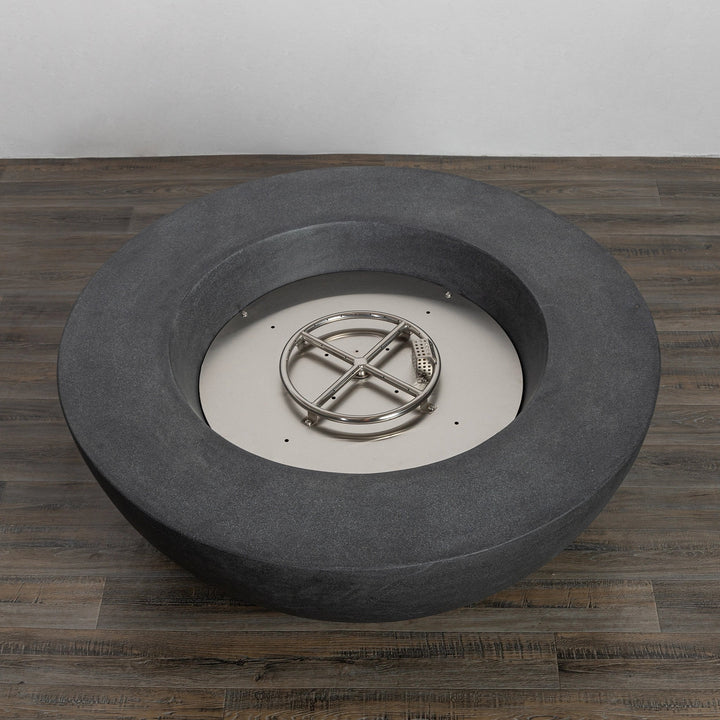 Top view of the Starfire Designs Beton 42 Inch Graphite Round Concrete Natural Gas Fire Pit with a stainless-steel round burner and open inner pit design, highlighting its durable construction, contemporary round shape, and ample space for lava rocks or fire glass.