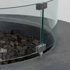 Close-up detail of the tempered glass wind guard on the Starfire Designs Beton 42 Inch Graphite Round Concrete Natural Gas Fire Pit, emphasizing its safety and added flame stability in windy outdoor environments.