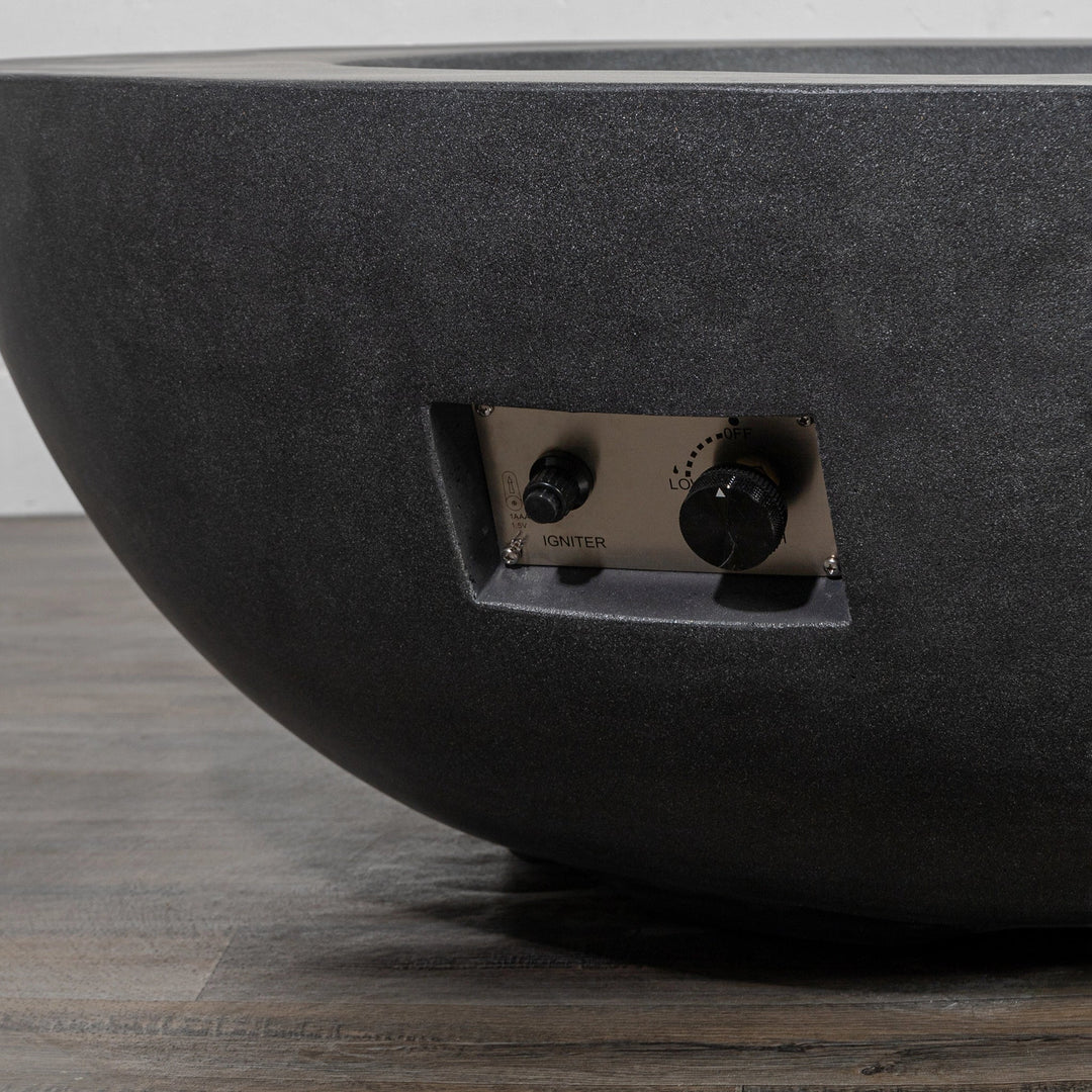Close-up view of the push-button ignition system and adjustable flame controls of the Starfire Designs Beton 42 Inch Graphite Round Concrete Natural Gas Fire Pit, showcasing the sleek stainless-steel panel and intuitive operation for enhanced usability and modern outdoor fire pit design.
