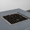 Top view of the Starfire Designs Beton 42" Natural Gray Square Hidden Propane Tank Gas Fire Pit filled with lava rocks, highlighting its premium build and minimalist aesthetics. Complements modern outdoor decor and offers efficient heat.