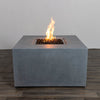 Front view of the Starfire Designs Beton 42" Natural Gray Square Hidden Propane Tank Gas Fire Pit, featuring a clean and modern square design with a durable concrete finish. The natural gray color complements outdoor spaces, showcasing its lava rocks and elegant flames. Ideal for patios and backyard gatherings.
