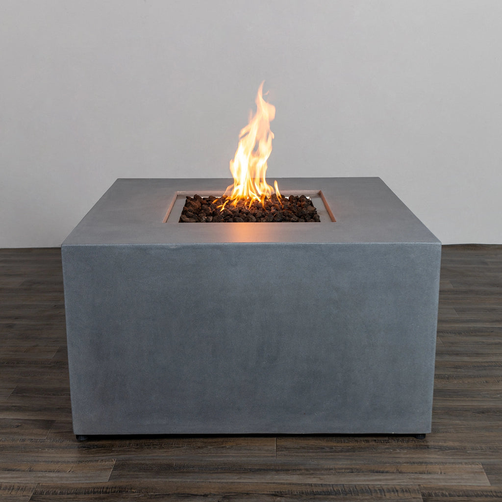 Front view of the Starfire Designs Beton 42" Natural Gray Square Hidden Propane Tank Gas Fire Pit, featuring a clean and modern square design with a durable concrete finish. The natural gray color complements outdoor spaces, showcasing its lava rocks and elegant flames. Ideal for patios and backyard gatherings.