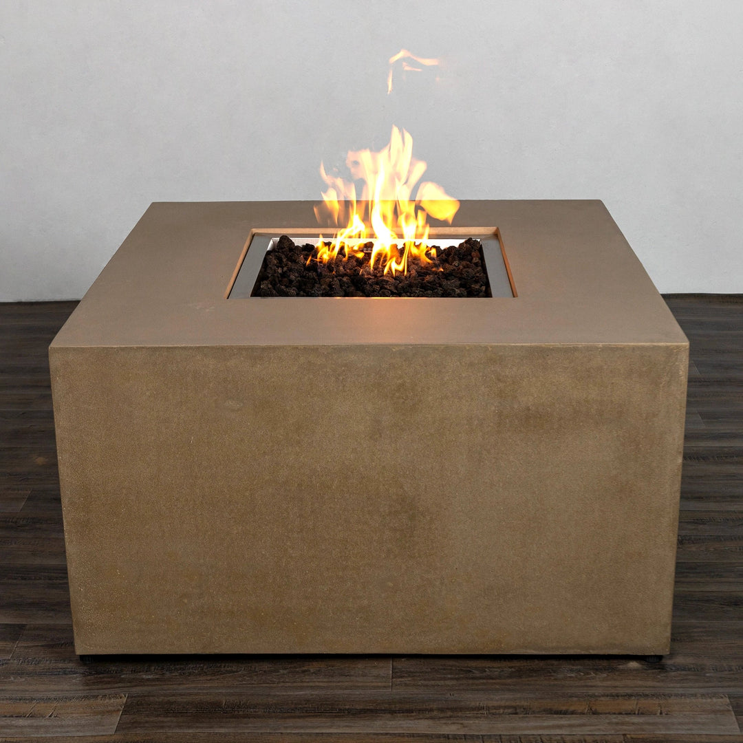 Side view of the Starfire Designs Beton 42-inch sand square hidden propane tank gas fire pit. Highlights include a durable concrete finish, ergonomic handles for mobility, and a modern minimalist outdoor fire pit style.