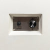 Close-up view of the control panel for the Starfire Designs Beton 55" White Rectangle Gas Fire Pit, featuring a stainless-steel igniter button and flame control dial. The control panel is recessed into the white GFRC concrete body for a sleek, minimalist look.
