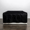 The Starfire Designs Beton 55" White Rectangle Hidden Propane Tank Gas Fire Pit is fully covered with a black protective weather cover. The durable, fitted cover drapes snugly over the fire pit, shielding it from outdoor elements. The cover's sleek black fabric contrasts with the white concrete base beneath.